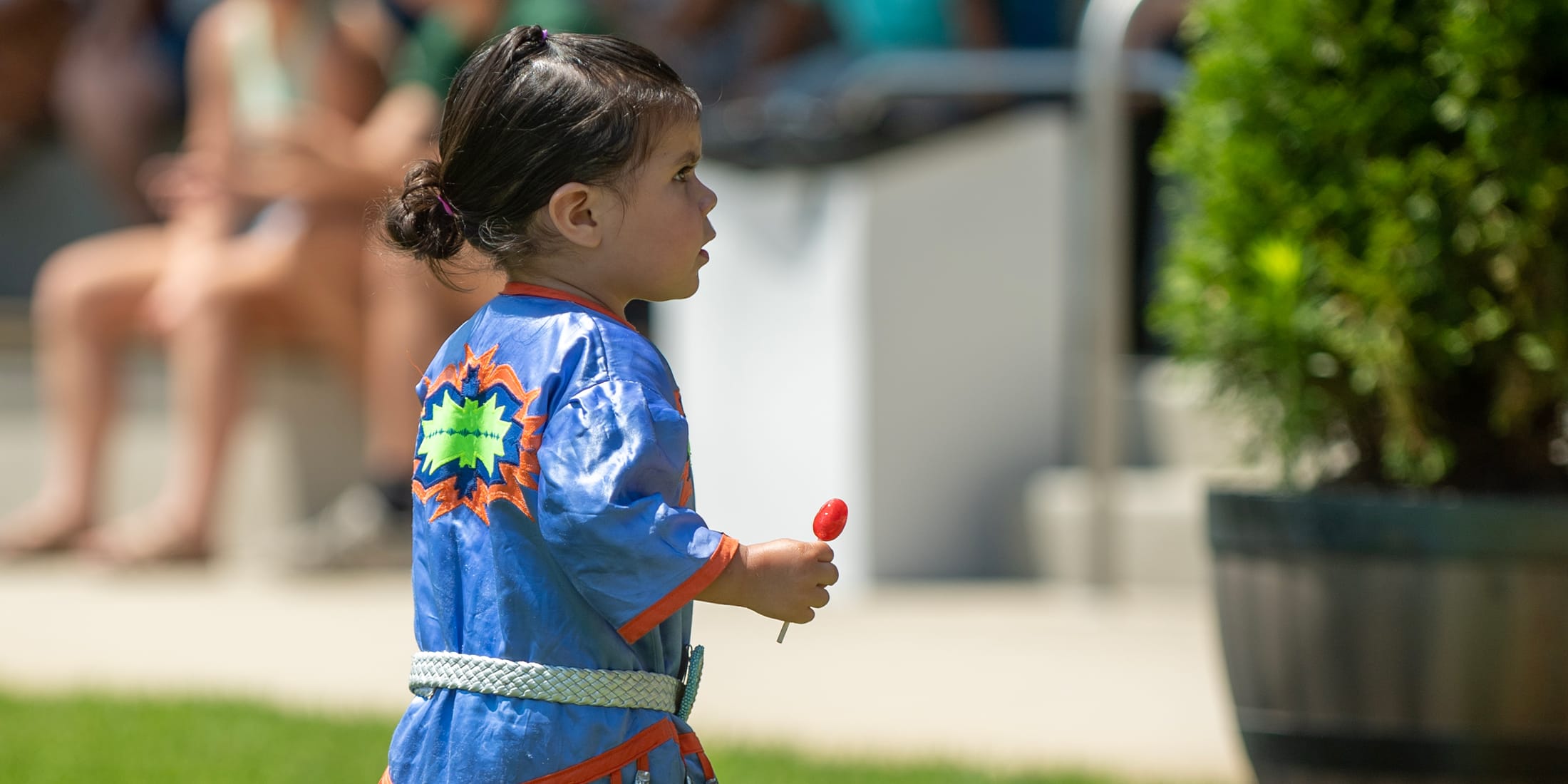 A young child with a sucker