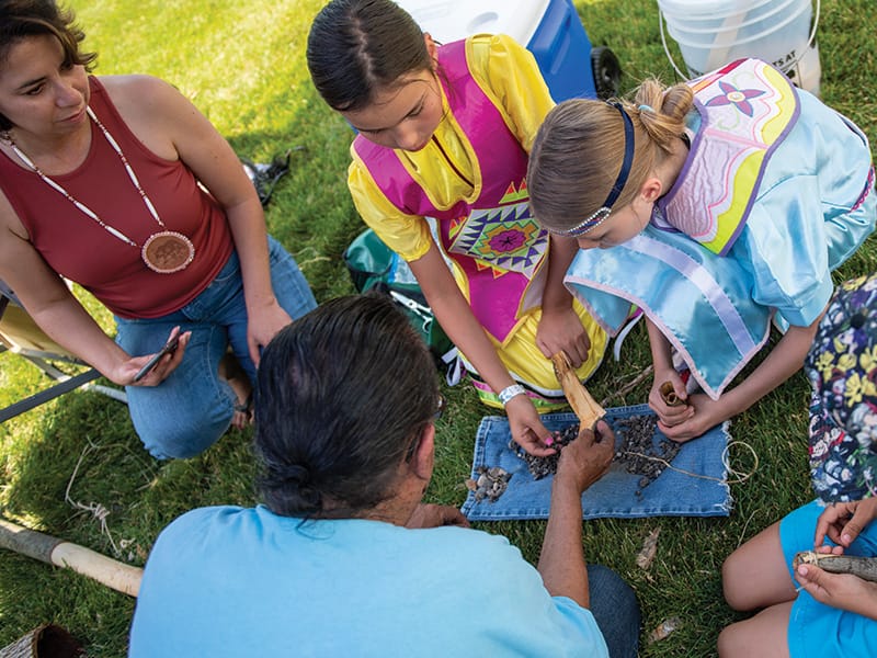 GunLake-Language-Culture2 Women and children working on a craft