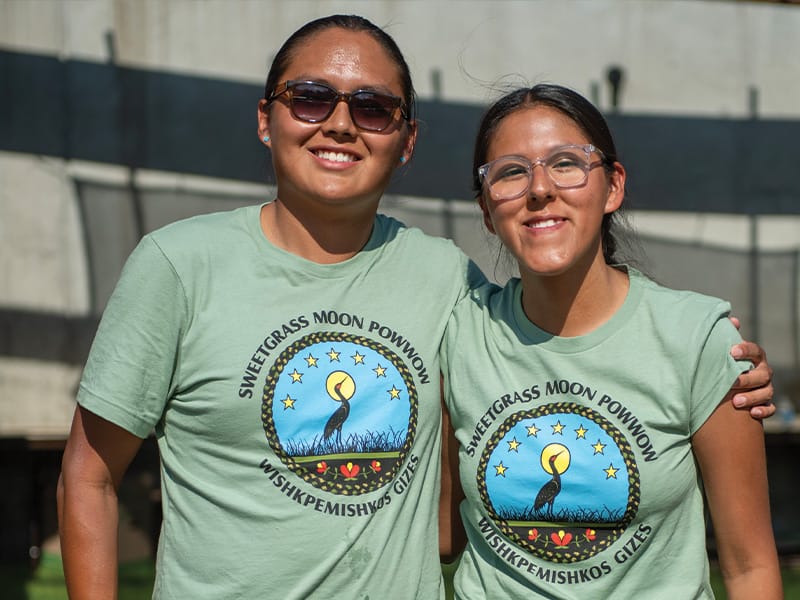 GunLake-Language-Culture3 Two people wearing matching Powwow shirts